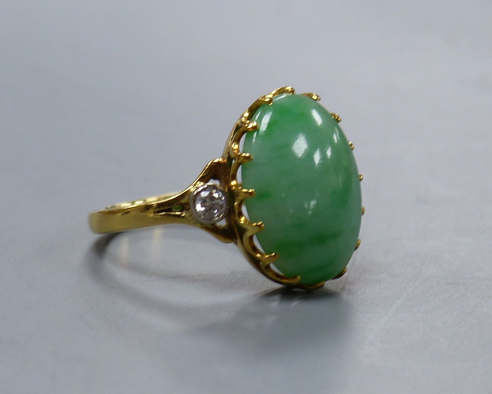 A jade and diamond dress ring, 18ct yellow gold setting